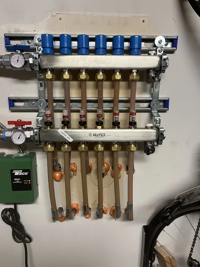 Plumber performing Water Heater Repair at a residential property in Roswell